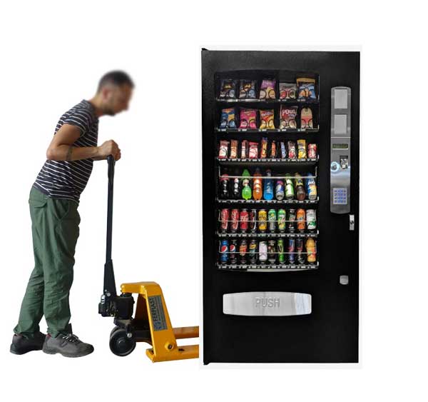 Vending Machine Transport - man moving vending machine using pallet jack