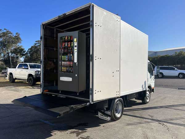 Vending Machine Transport - Pantech truck with tailgate loader and vending machine loaded